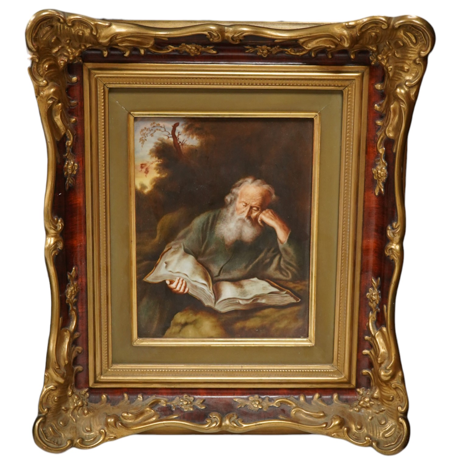 A Rosenthal porcelain plaque, 'The Hermit', housed in an ornate gilt frame, 45cm high overall